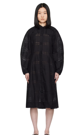 A woman wearing Henrik Vibskov black spam midi dress