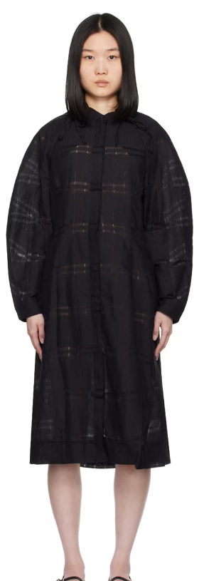 A woman wearing Henrik Vibskov black spam midi dress