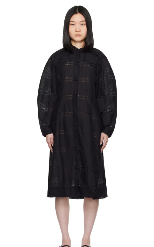 A woman wearing Henrik Vibskov black spam midi dress