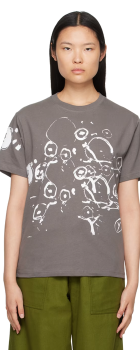 A woman wearing Gentle Fullness gray graphic t-shirt