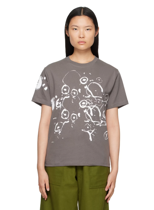 A woman wearing Gentle Fullness gray graphic t-shirt