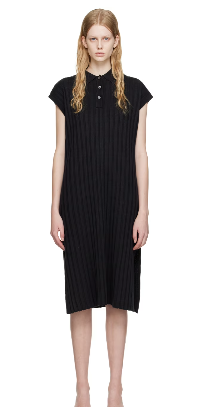 A woman wearing HOPE black nad midi dress
