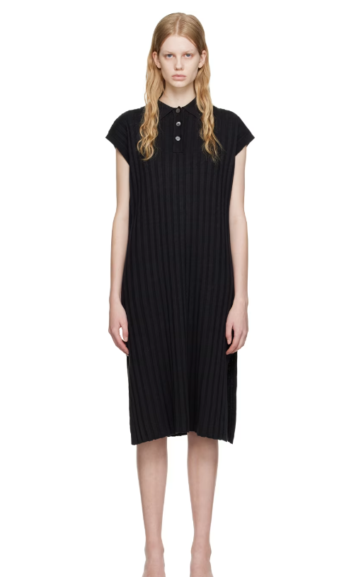 A woman wearing HOPE black nad midi dress