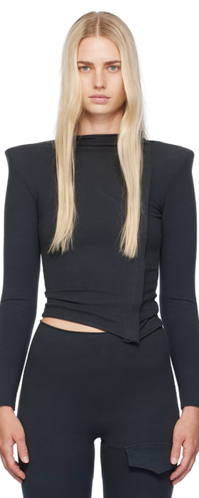 A woman wearing Greg Ross ssense exclusive black zip top