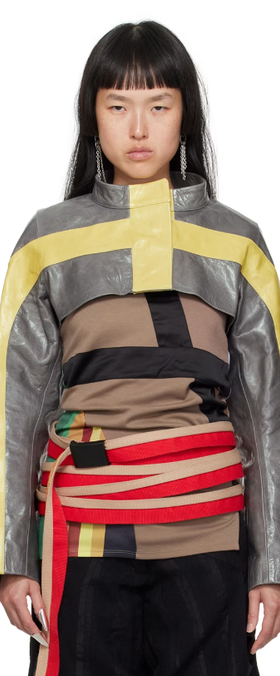 A woman wearing DIANA STRÄNG gray & yellow cropped leather jacket