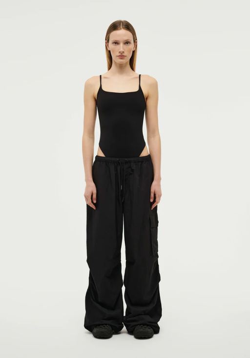 A woman wearing P.E Nation preview bodysuit in black