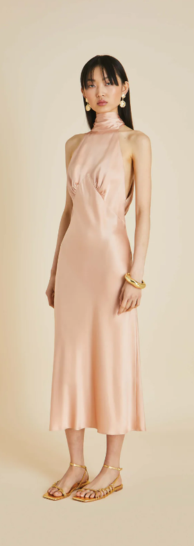 A woman wearing Olivia von Halle pink greta shell pink halterneck dress