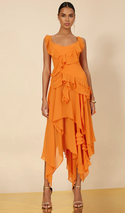 A woman wearing BCBGMAXAZRIA russet orange annabel ruffle dress
