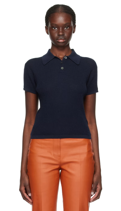 A woman wearing Guest in Residence navy shrunken polo