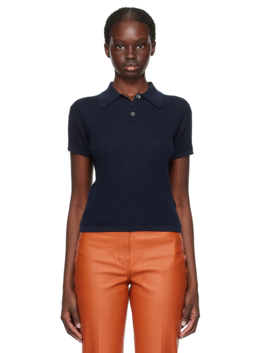A woman wearing Guest in Residence navy shrunken polo