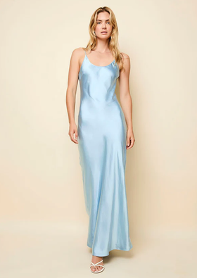 A woman wearing Solid & Striped ice blue the selena satin dress