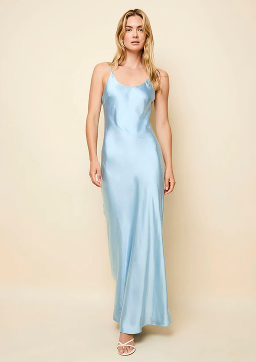 A woman wearing Solid & Striped ice blue the selena satin dress