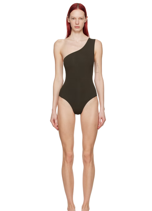 A woman wearing ERES brown effigie swimsuit