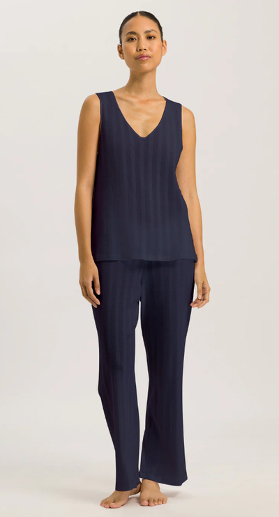 A woman wearing Hanro deep navy tank cropped pajama