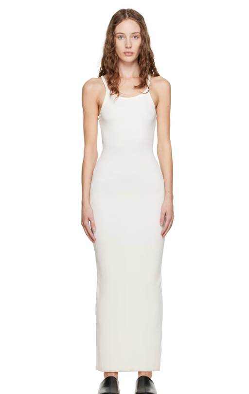A woman wearing Éterne off-white tank maxi dress