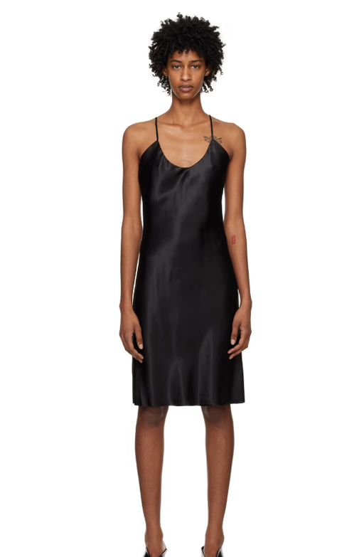 A woman wearing GIA STUDIOS black v-neck minidress
