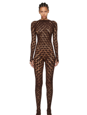 A woman wearing Isa Boulder brown argyle centauri jumpsuit
