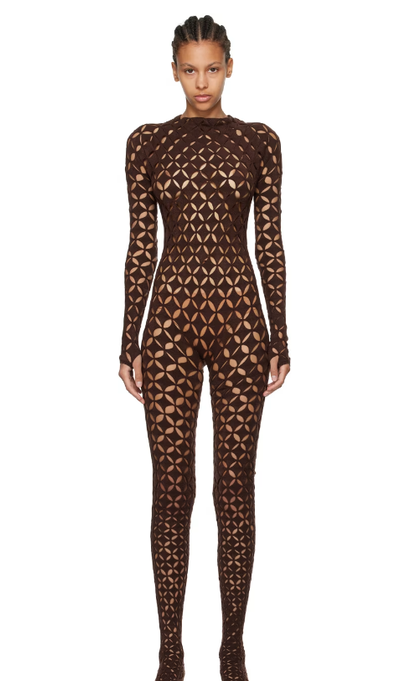 A woman wearing Isa Boulder brown argyle centauri jumpsuit