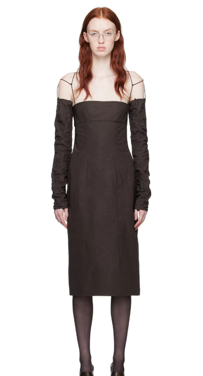 A woman wearing Elena Velez brown straight midi dress
