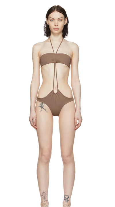 A woman wearing DU CIEL ssense exclusive brown marseille one-piece swimsuit