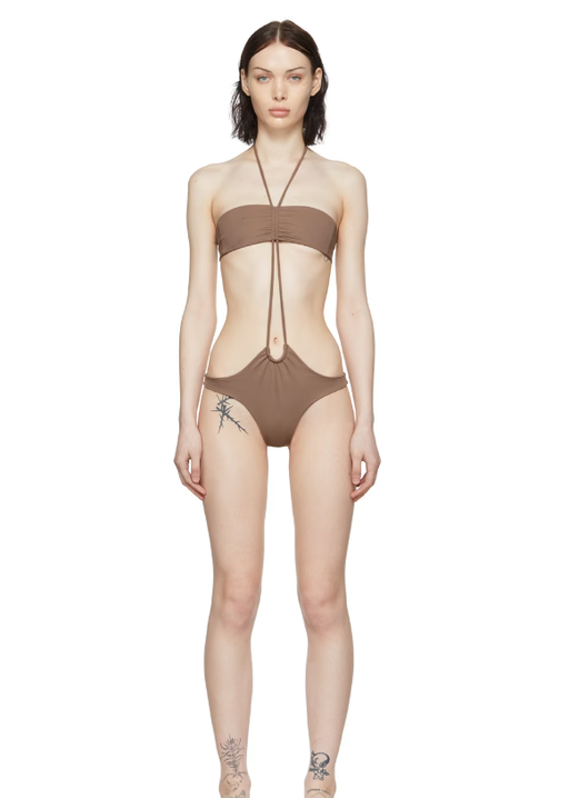 A woman wearing DU CIEL ssense exclusive brown marseille one-piece swimsuit