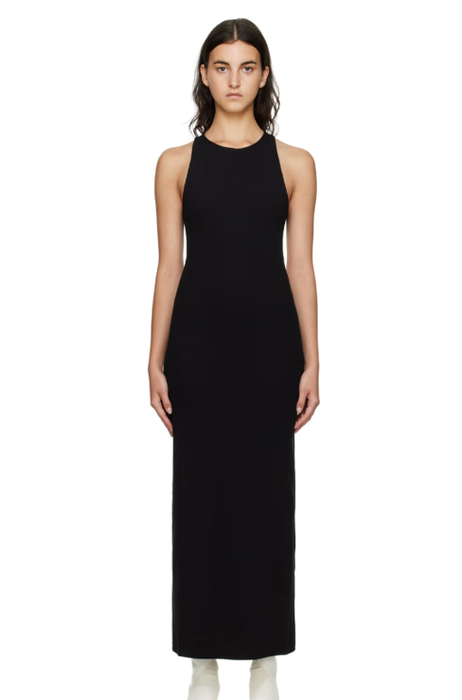 A woman wearing GAUCHERE black ribbed midi dress
