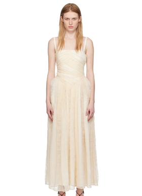 A woman wearing Interior off-white 'the usi' maxi dress