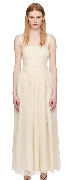 A woman wearing Interior off-white 'the usi' maxi dress