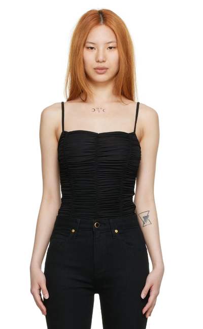 A woman wearing Goldsign black nylon bodysuit