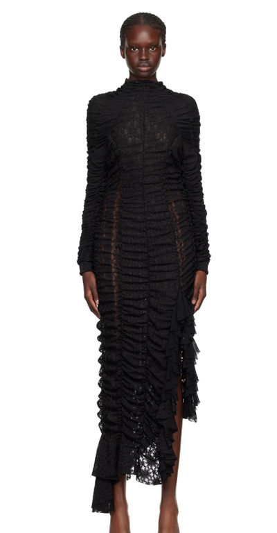 A woman wearing Ester Manas black ruched midi dress