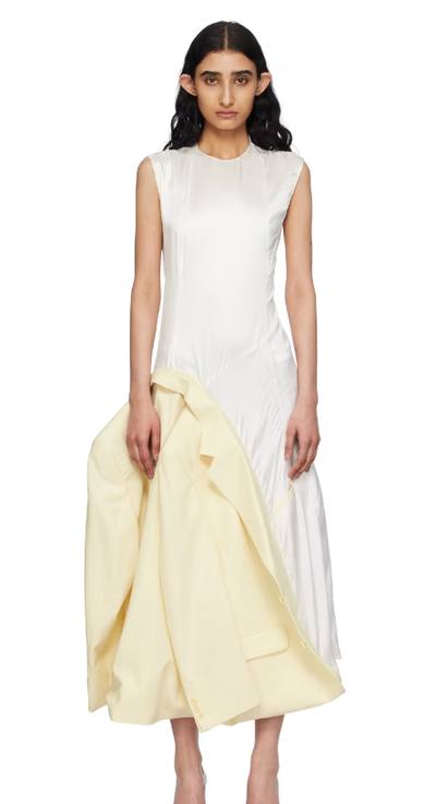 A woman wearing HODAKOVA off-white inside out suit jacket maxi dress