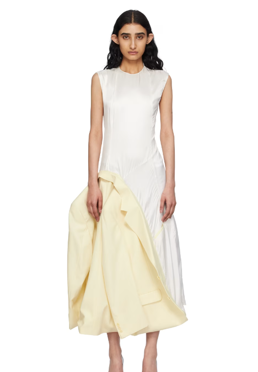 A woman wearing HODAKOVA off-white inside out suit jacket maxi dress