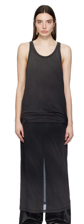 A woman wearing doublet black layered maxi dress