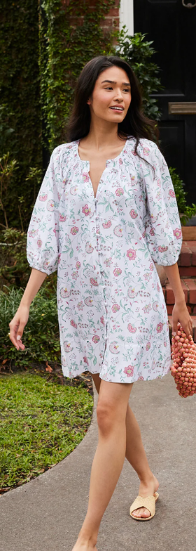 A woman wearing Lake Pajamas garden vines hammock shirt dress in garden vines