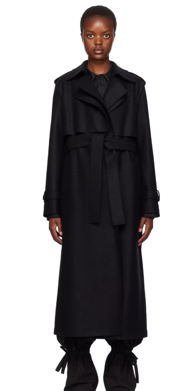 A woman wearing Harris Wharf London black long trench coat