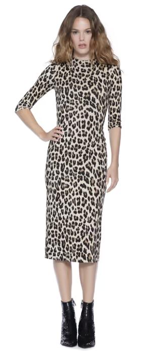 A woman wearing Alice + Olivia delora fitted mock neck midi dress