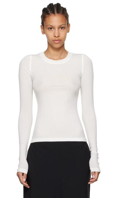 A woman wearing Fax Copy Express white 'the round neck' long sleeve t-shirt