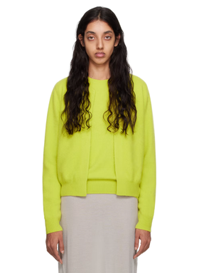 A woman wearing Frenckenberger yellow mini bomber cardigan