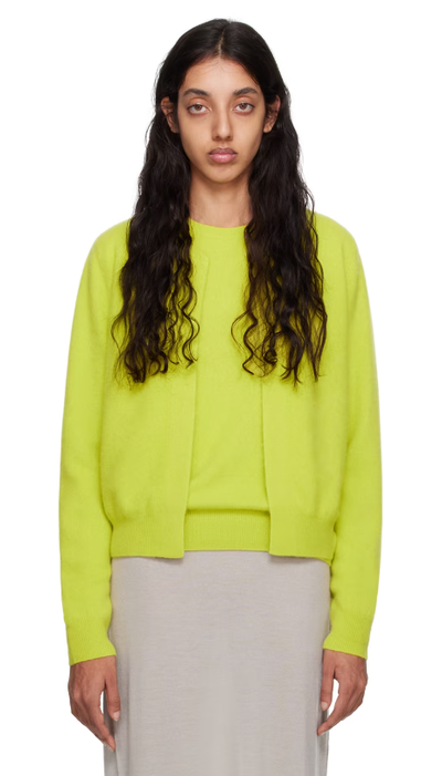 A woman wearing Frenckenberger yellow mini bomber cardigan