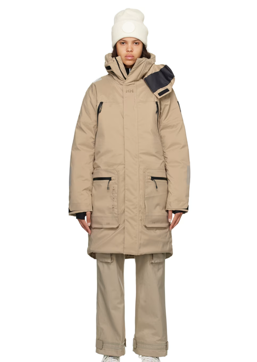 A woman wearing HH-118389225 beige arc ins flow down jacket
