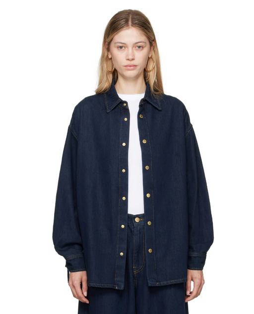 A woman wearing DARKPARK blue keanu denim shirt