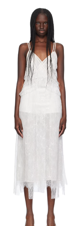 A woman wearing BLUMARINE white ruffled maxi dress