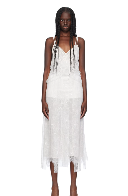 A woman wearing BLUMARINE white ruffled maxi dress