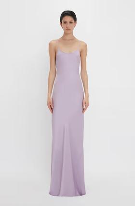 A woman wearing Victoria Beckham purple low back cami floor-length dress in petunia