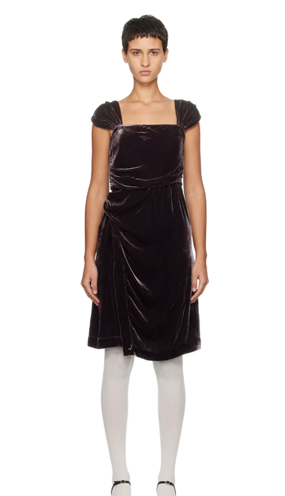 A woman wearing CARO EDITIONS brown sophie midi dress