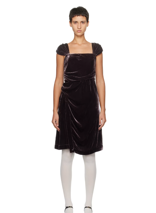A woman wearing CARO EDITIONS brown sophie midi dress