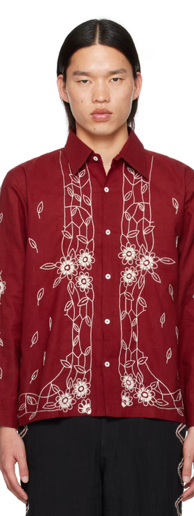 A man wearing Harago burgundy embroidered shirt