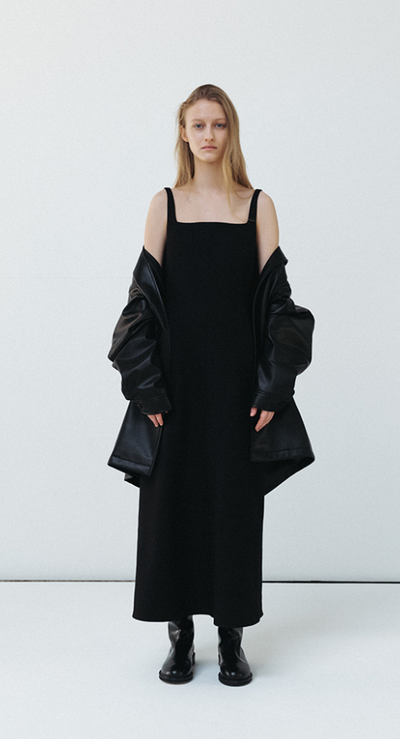 A woman wearing Le 17 Septembre caroline long black dress