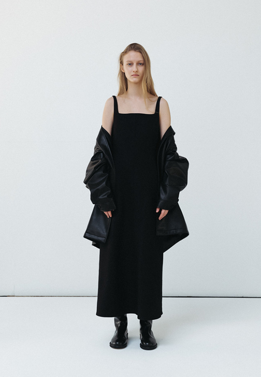 A woman wearing Le 17 Septembre caroline long black dress