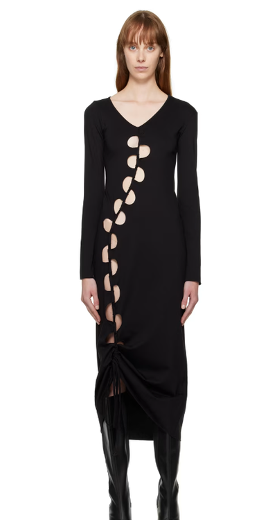 A woman wearing AVAVAV black cutout maxi dress